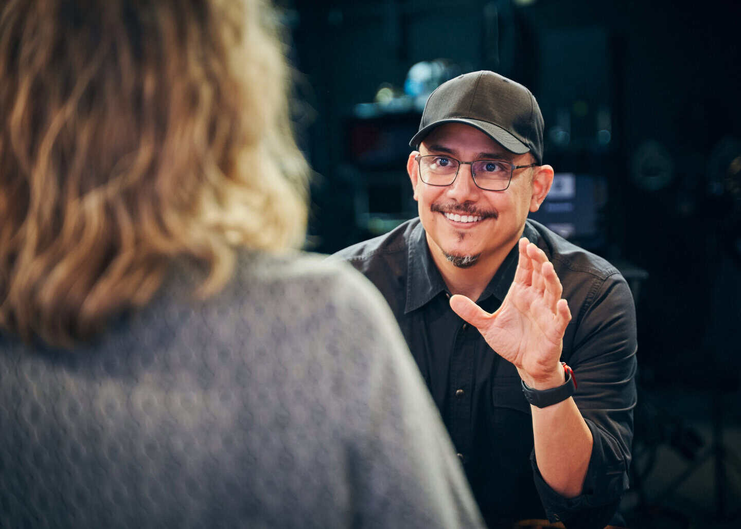 Shawn Fernandez in conversation with a client